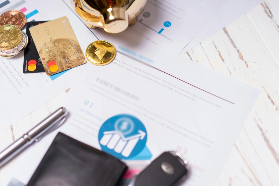 Financial report with credit cards and currency displayed.