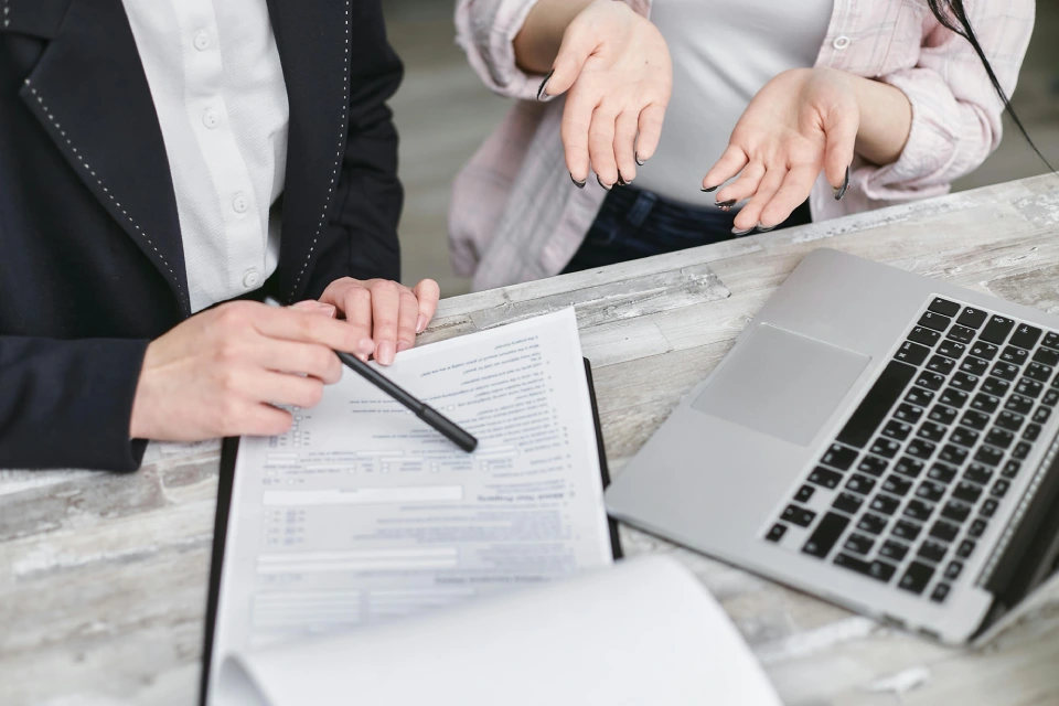 Professional reviewing a document with a colleague