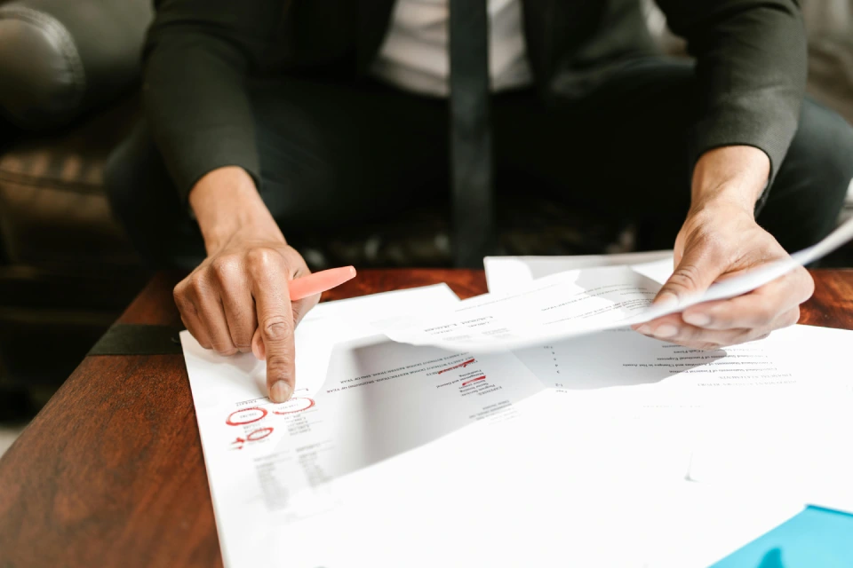 Businessman examining financial reports and documents